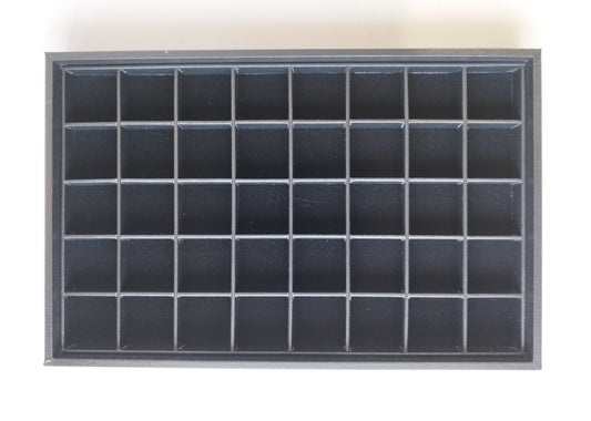 Black leather-style box with magnetic closure and sectioned interior. (28,5 * 19 * 3 cm)