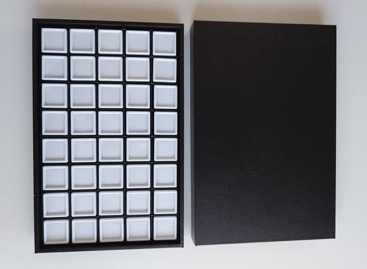 Black leather-style box with magnetic closure and sectioned interior. (28,5 * 19 * 3 cm)